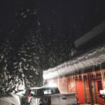 black car on road during snow