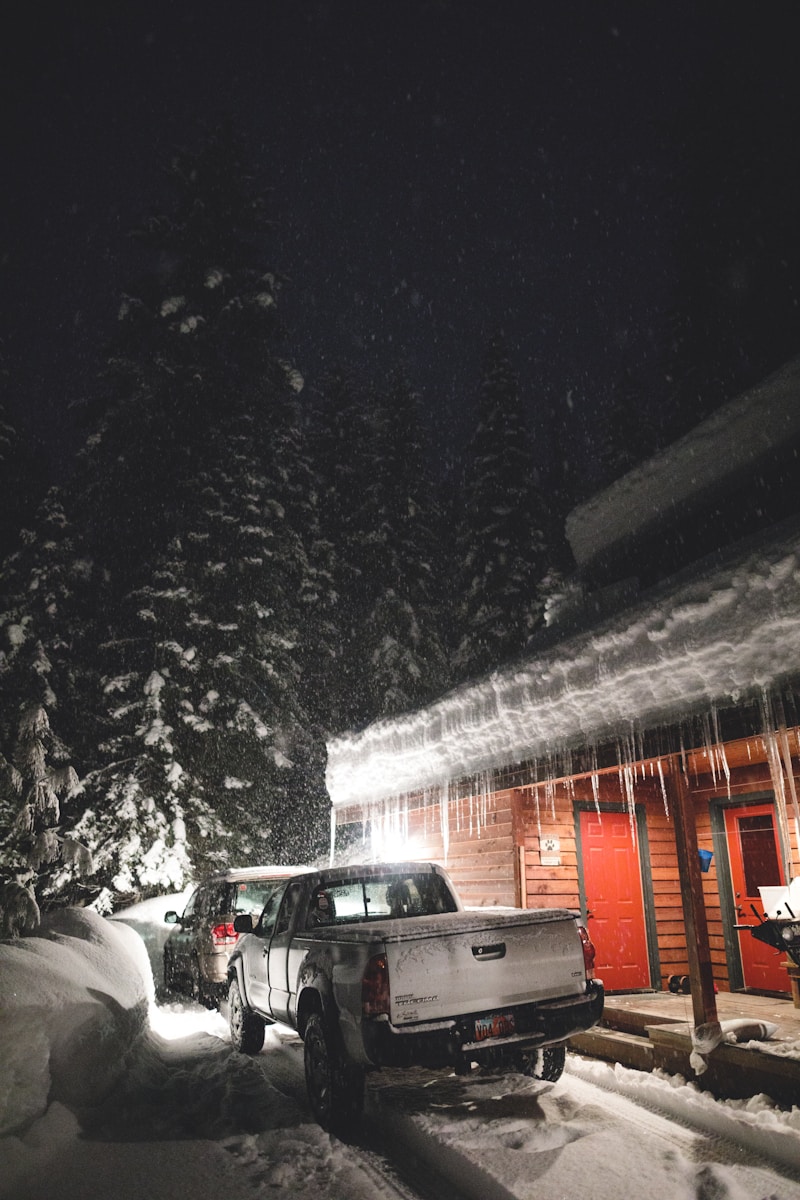 black car on road during snow
