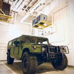 green SUV in garage