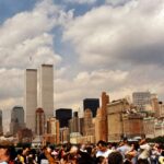 a crowd of people in front of a city skyline