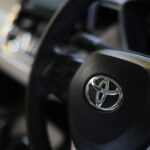 a close up of a steering wheel of a car